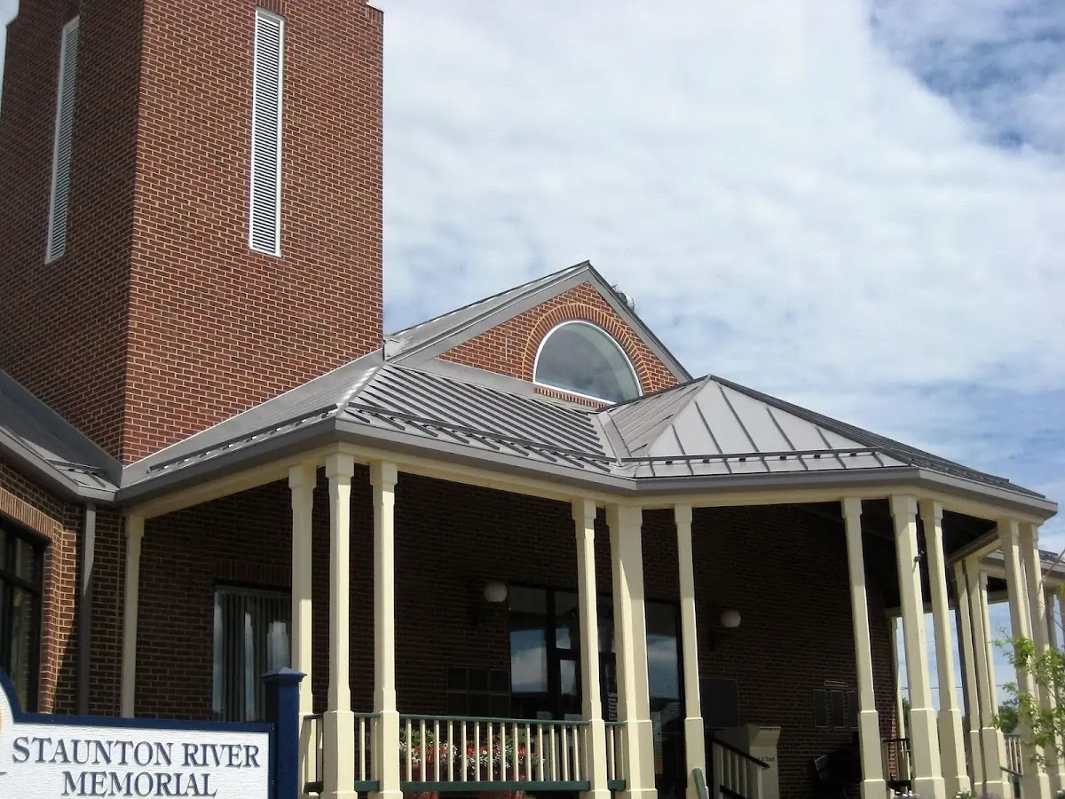 Skilled roofing craftsmen working on a residential roof in Attalla